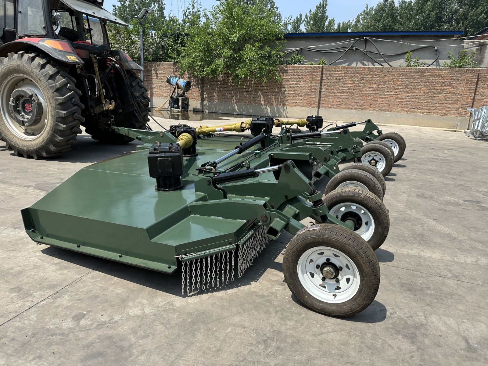 Trailed folding wing mower